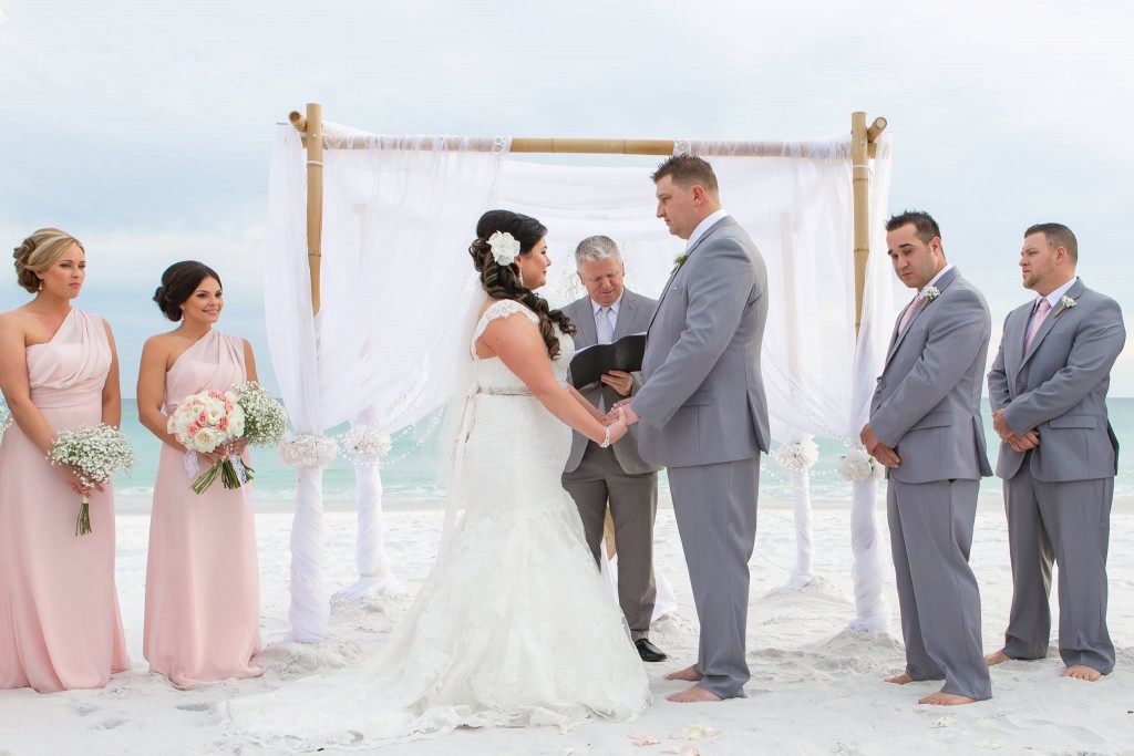 destin beach wedding ceremony with bamboo arbor