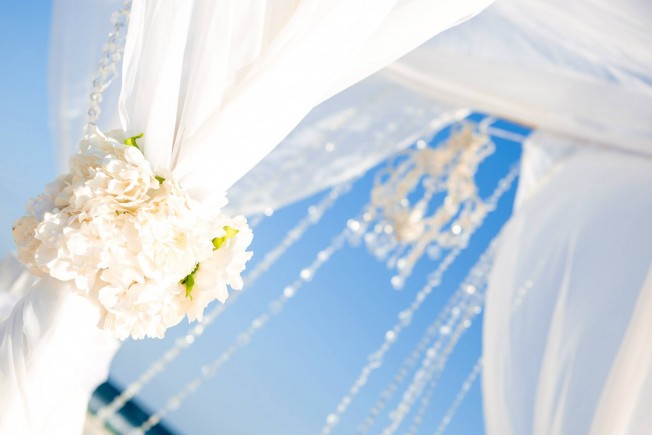 crystal chandelier on bamboo arbor, panama city beach florida beach wedding