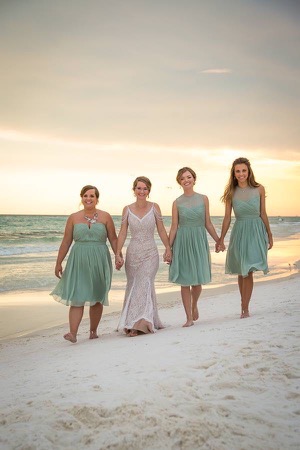 bridesmaids-sunset-beach-ceremony